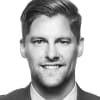 En profilbild av fastighetsmäklare Vincent Hellman