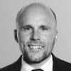 En profilbild av fastighetsmäklare Nicklas Arnesson