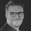 En profilbild av fastighetsmäklare Joakim Soininen