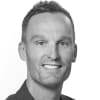 En profilbild av fastighetsmäklare Mikael Holmer