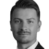En profilbild av fastighetsmäklare Linus Meyer