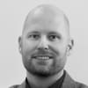 En profilbild av fastighetsmäklare Markus Bylund
