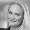 En profilbild av fastighetsmäklare Anna Wikstrand Delic