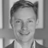 En profilbild av fastighetsmäklare Marcus Brunberg