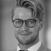 En profilbild av fastighetsmäklare Thomas Jonasson
