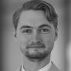 En profilbild av fastighetsmäklare Isak Kanon