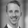 En profilbild av fastighetsmäklare Jonatan Werner