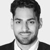 En profilbild av fastighetsmäklare Rayan Hakim