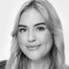 En profilbild av fastighetsmäklare Nora Berg