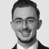 En profilbild av fastighetsmäklare Michel Dagher