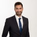En profilbild av fastighetsmäklare Babil Yilmaz