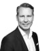 En profilbild av fastighetsmäklare Per Lind
