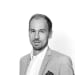 En profilbild av fastighetsmäklare Marcus Marcelius Samnegård