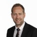 En profilbild av fastighetsmäklare Mathias Ek