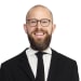 En profilbild av fastighetsmäklare Peter Backlund