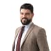 En profilbild av fastighetsmäklare Behrang Jamal