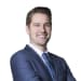 En profilbild av fastighetsmäklare Alexander Langer