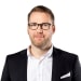 En profilbild av fastighetsmäklare Jon Ralph