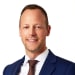 En profilbild av fastighetsmäklare Henrik Sjöberg