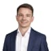 En profilbild av fastighetsmäklare Erik Wallström