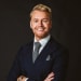 En profilbild av fastighetsmäklare Anders Nilsson Wall