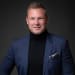En profilbild av fastighetsmäklare Andreas Agerborn