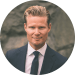 En profilbild av fastighetsmäklare Christian Lundin