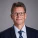 En profilbild av fastighetsmäklare Hans Edmark