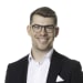 En profilbild av fastighetsmäklare Olof Haraldsson