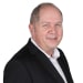 En profilbild av fastighetsmäklare Göran Rosdalen