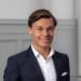 En profilbild av fastighetsmäklare Filip Ljungström