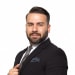 En profilbild av fastighetsmäklare Elie Sabbagh