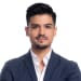 En profilbild av fastighetsmäklare Daniel Garzon Rodriguez