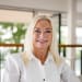 En profilbild av fastighetsmäklare Helena Ullhag