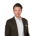 En profilbild av fastighetsmäklare Joakim Andersson