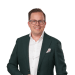 En profilbild av fastighetsmäklare Andreas Köhler