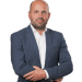 En profilbild av fastighetsmäklare Håkan Lindén