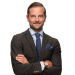 En profilbild av fastighetsmäklare Daniel Rehn