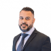 En profilbild av fastighetsmäklare Ali Mozil