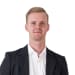 En profilbild av fastighetsmäklare Robin Karlsson
