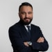 En profilbild av fastighetsmäklare Farzad Mirzazadeh