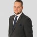 En profilbild av fastighetsmäklare Oskar Lund