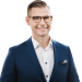 En profilbild av fastighetsmäklare Alexander Bergh