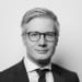 En profilbild av fastighetsmäklare Eric Melkersson