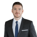 En profilbild av fastighetsmäklare Andreas Hansson