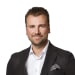 En profilbild av fastighetsmäklare Michael Lundholm