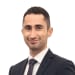 En profilbild av fastighetsmäklare Håkan Korkmaz