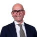 En profilbild av fastighetsmäklare Martin André