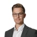 En profilbild av fastighetsmäklare Andreas Stiglund