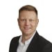 En profilbild av fastighetsmäklare Karl Dahlin